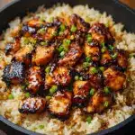 Toss your chicken thighs in half the sauce, then lay them in the dish Recipe