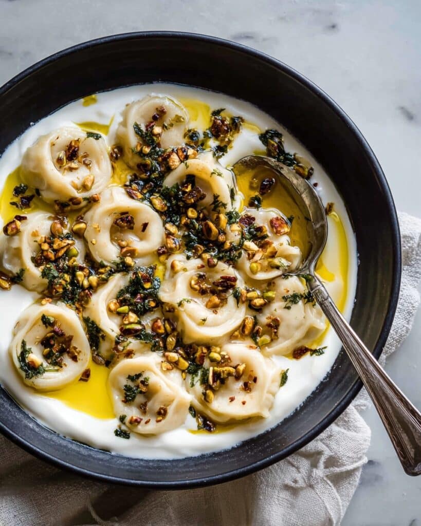 Shish Barak with Yogurt Sauce and Garlic Pine Nut Topping Recipe