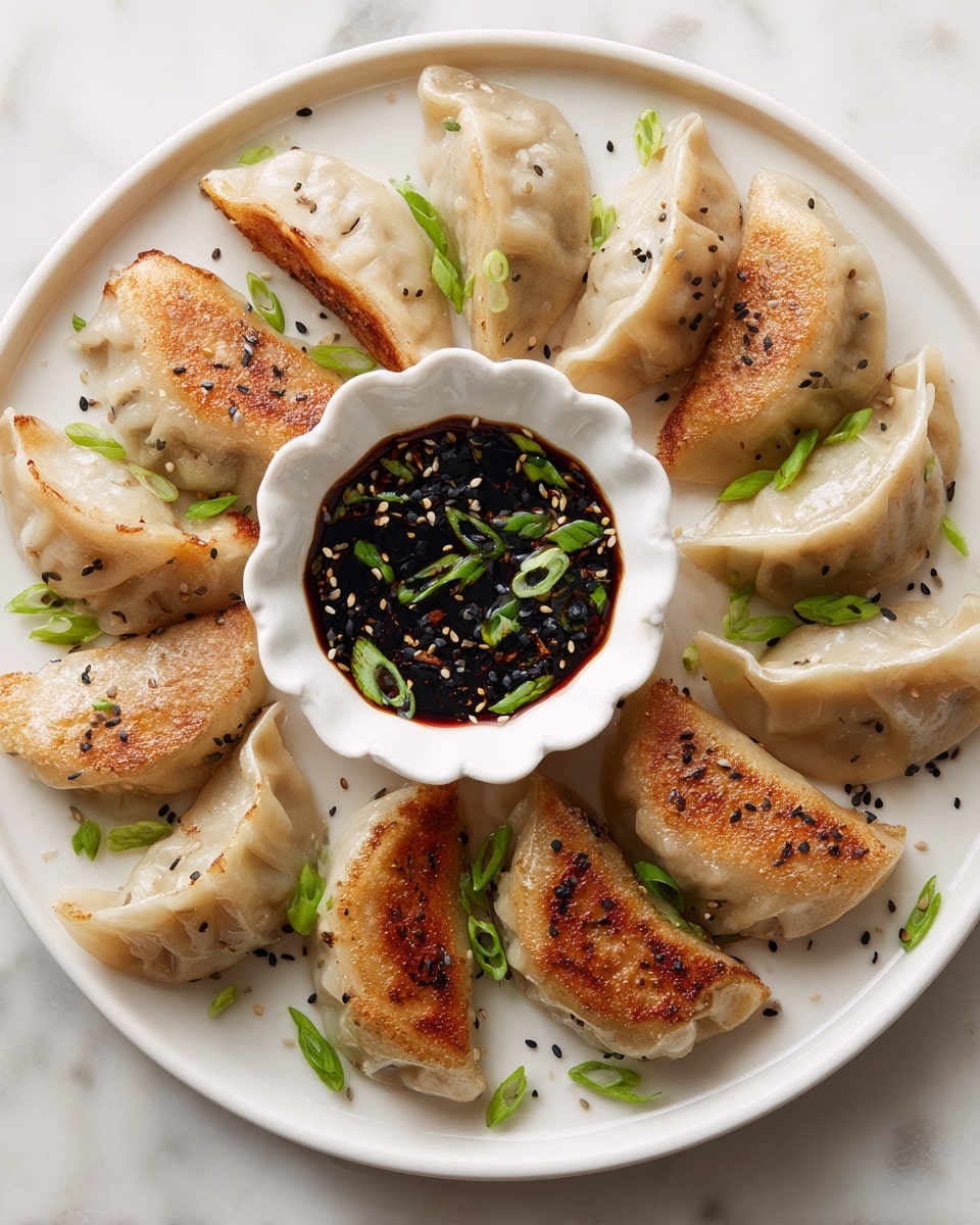 A round white plate holds about twelve pan-fried dumplings arranged around a small white scalloped bowl filled with dark soy dipping sauce mixed with thinly sliced green onions. The dumplings have a golden-brown crispy base and soft, light beige tops with some pleated edges, sprinkled with small black sesame seeds and green onion pieces scattered over the plate. The background is a white marbled texture. photo taken with an iphone --ar 4:5 --v 7