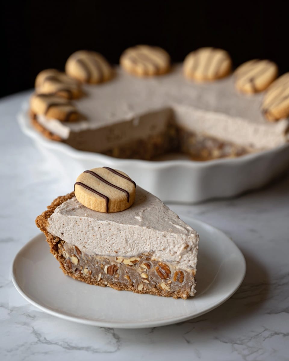 A pie with a golden-brown crust that has a wavy edge, filled with a smooth brown layer beneath a thick, light brown whipped cream topping that is textured and uneven. On top of the whipped cream, small round cookies with a light beige color and dark chocolate stripes are placed scattered around. The pie is in a white dish with a scalloped edge, sitting on a white marbled surface. photo taken with an iphone --ar 4:5 --v 7